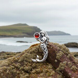 Celtic Mermaid holding a Garnet Under the Sea Pendant